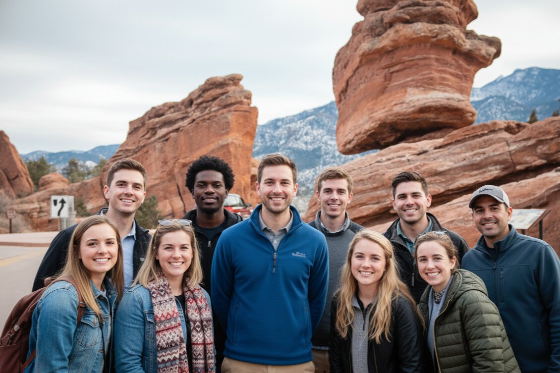 Tour group with balance rock in background Garden of the Gods